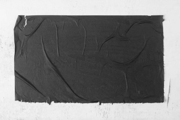 Black sheet of paper with folds.