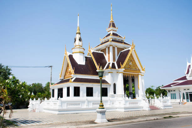 istock Beautiful ancient white crematory architecture or antique funeral pyre building thai style of Wat Ku or Phra Nang Rua Lom temple for local people use service at Pak Kret city in Nonthaburi, Thailand 1491513237