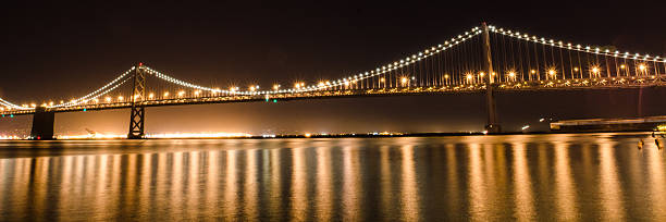 istock Bay Bridge Glowing In The Night 149151458