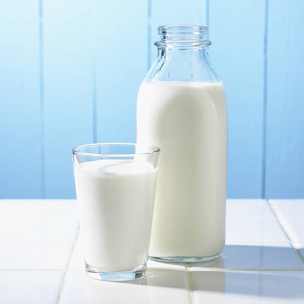 istock Traditional milk bottle with a glass full 149151468