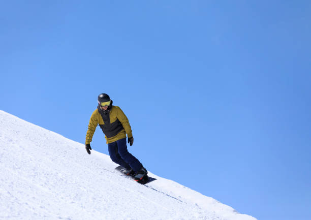 istock Snowboarding   Young man  snowboarder  on the mountain ski slope 1491518031