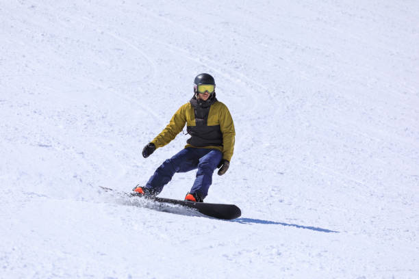 istock Snowboarding   Young man  snowboarder  on the mountain ski slope 1491518045