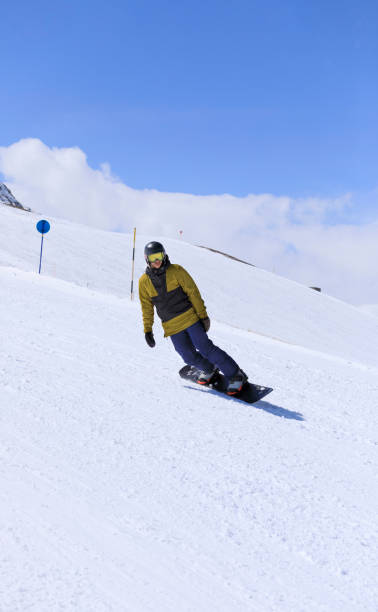 istock Snowboarding   Young man  snowboarder  on the mountain ski slope 1491518344