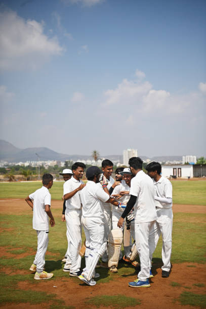 istock Cricket team players celebrating victory after winning test match. 1491518508