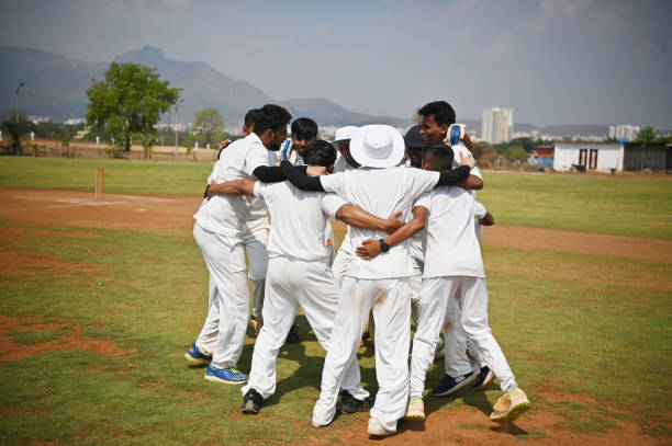 istock Cricket team players celebrating victory after winning test match. 1491518517
