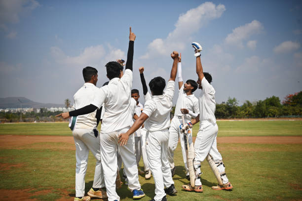 istock Cricket team players celebrating victory after winning test match. 1491518519