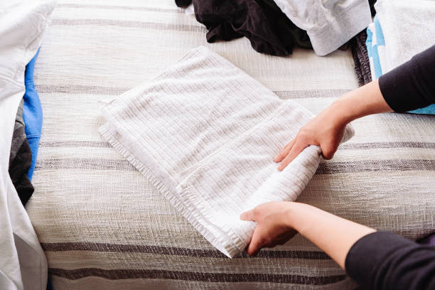 istock Housework ;  Folding laundry in the bedroom 1491518687