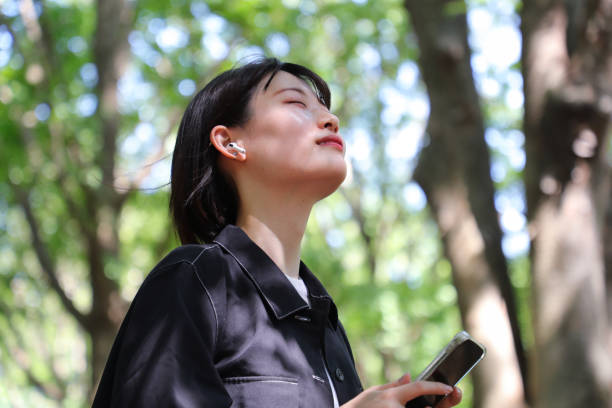istock Woman listening music 1491521432