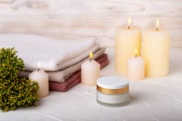 istock Face cream, candles and towels 1491524972