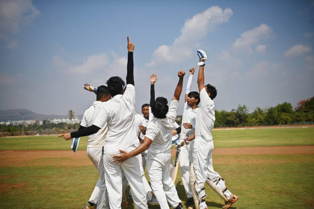 istock Cricket team players celebrating victory after winning test match. 1491525565