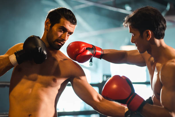 Free Stock Photo of Two men wearing boxing gloves and helmets ...