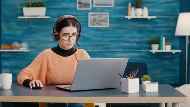 istock Young person talking on online videoconference with headphones 1491527183