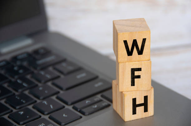 istock WFH letter on woooden cube. Work From Home concept 1491527215
