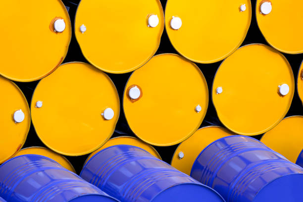 istock Stack of yellow and blue 200 liter oil drums group 1491528522