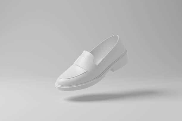 White chunky loafer floating in mid air with shadow on white background in monochrome. Illustration of the concept of footwear, menswear and fashion