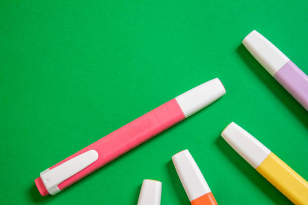 istock Colorful markers on a green background 1491532251