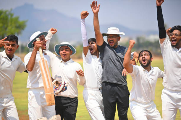istock Cricket team players along with the coach celebrating victory 1491533013