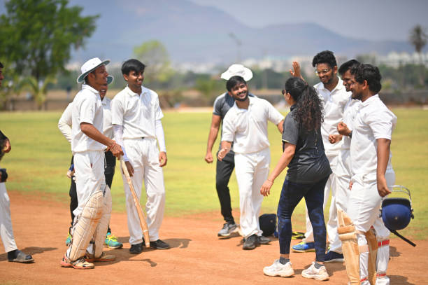 istock Cricket players celebrating victory with team members 1491533018