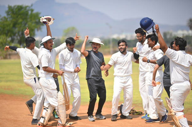 istock Cricket team players along with the coach celebrating victory 1491533024