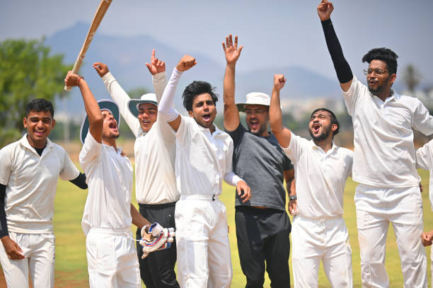 istock Cricket team players along with the coach celebrating victory 1491533025