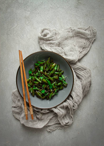 fried bean pods, in soy sauce, with sesame seeds, homemade, no people,
