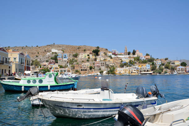 istock Boats in a harbor with a hill in the background 1491538596