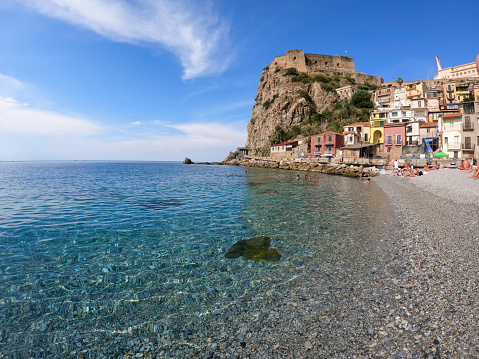Scilla Calabria Italy on September 8, 2021 The sea and the color in a mediterranean beach under a castle (Scilla south Italy Calabria)