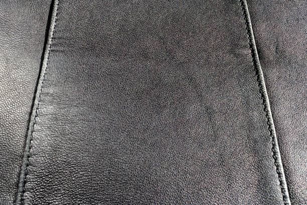 istock Leather black color. Black background, skin texture. Copy space 1491543843
