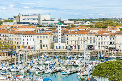 Green lighthouse of the Old Port of La Rochelle on the Quai Valin street seen from above in France