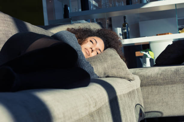 istock Woman on couch, sunlit face, she's stunning 1491544554