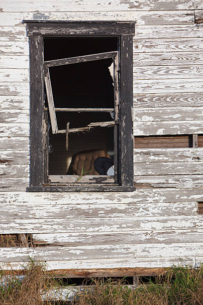 istock broken window of abondoned home 149154965