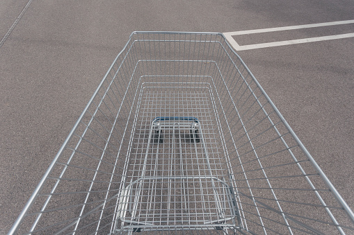 Pushing empty shopping cart. Personal perspective