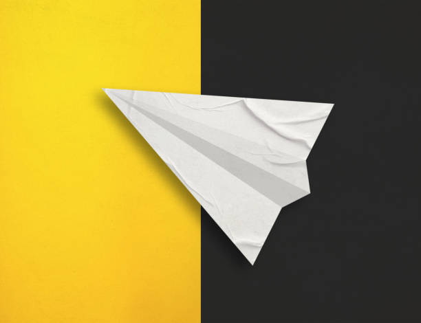 istock Paper airplane on colorful paper background 1491552376