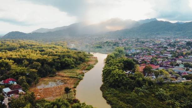 istock early morning natural scenery in small town between mountains and river 1491552520