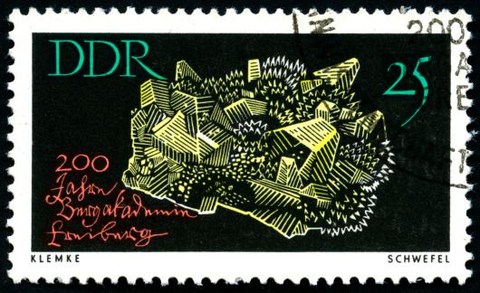 Close up of postage stamp from the GDR, showing a sulfuric crystal