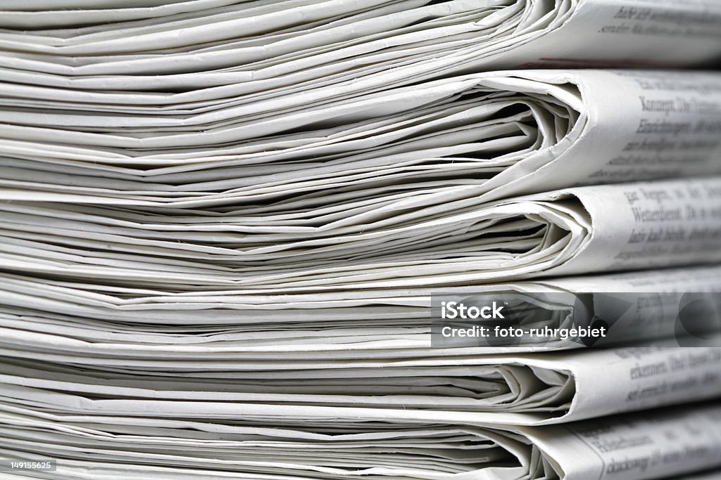 A stack of six or seven newspapers Several newspapers on one another and form a stack. Bright Stock Photo