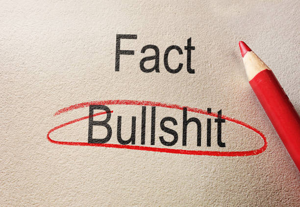 istock Bullshit circled in red pencil below Fact text, on textured paper 1491559341