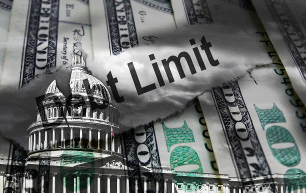 Debt Limit newspaper headline on hundred dollar bills with cracked United States Capitol dome representing political gridlock Debt Limit newspaper headline on hundred dollar bills with  cracked United States Capitol dome representing political gridlock debt ceiling stock pictures, royalty-free photos & images