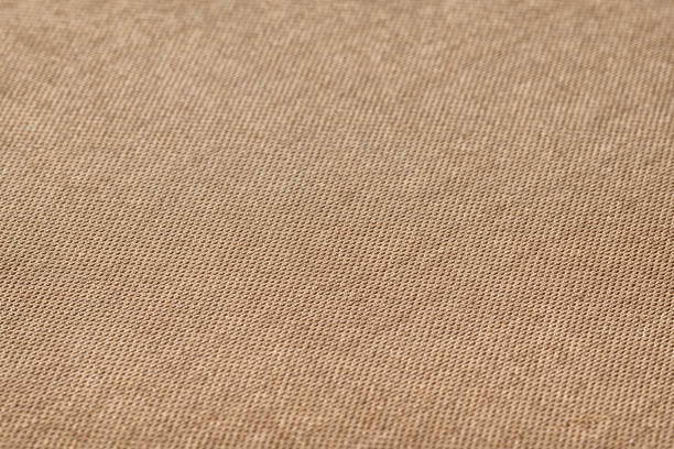 istock Texture of flat brown perforated cardboard, background. 1491559456