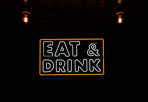 istock Eat and Drink neon sign with vintage lightbulbs and ceiling 1491559578