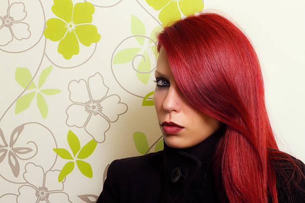 Portrait of young woman with red hair