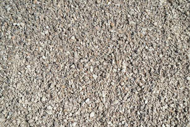 istock Top view grey and beige gravel stone background. 1491559730