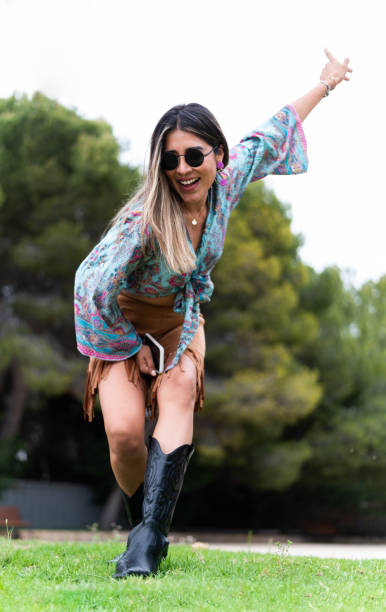 istock Fashionable woman playing while posing on a garden 1491560650