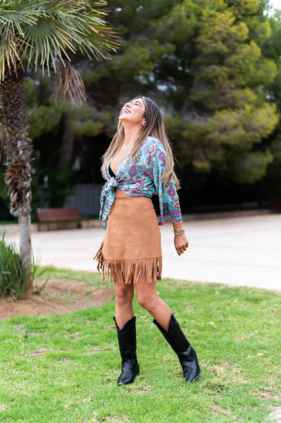 istock Beauty woman dancing happily on a park 1491560842