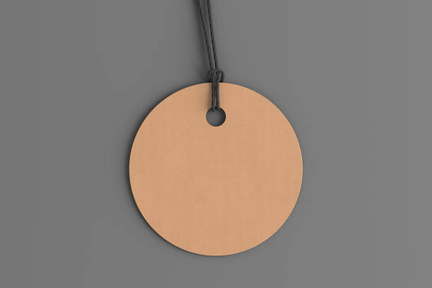 istock Cardboard round tag mockup on gray background. View directly above 1491560996