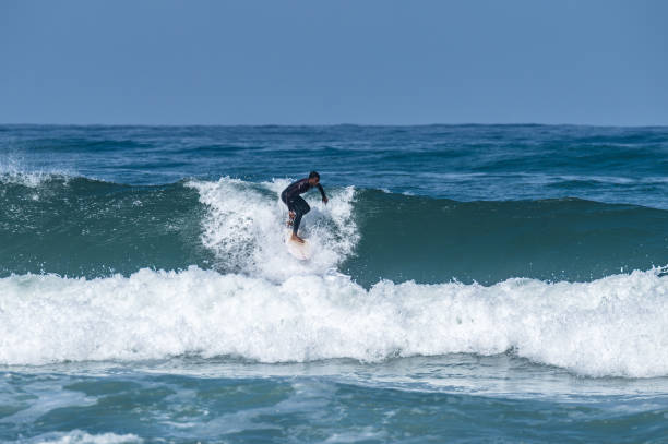 istock Surfer riding waves in Furadouro Beach 1491561661