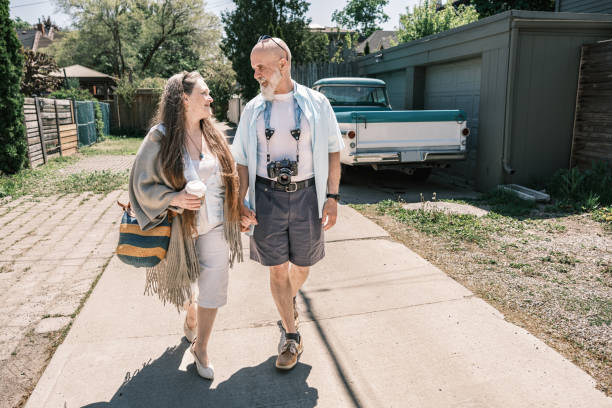Senior  Couple sightseeing  the city. Both dressed in casual clothes . Exterior of urban area of North American city.