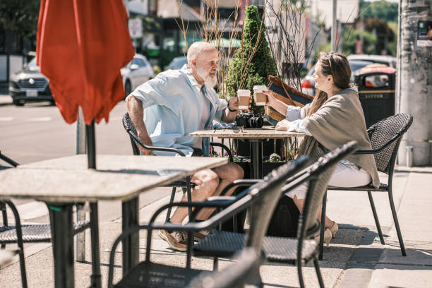 istock Senior  Couple taking a coffee break from sightseeing  the city 1491571389