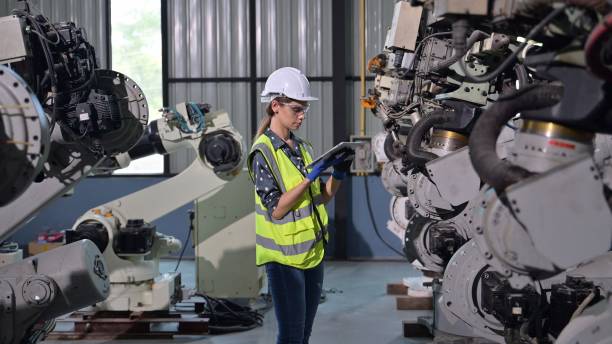 istock Business owner engineer managing and checking work at factory 1491571771