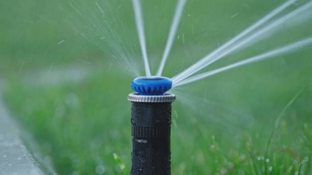 istock Stationary Retractable Popup Automatic Sprinkler Nozzle Watering Garden Grass Lawn 1491572577